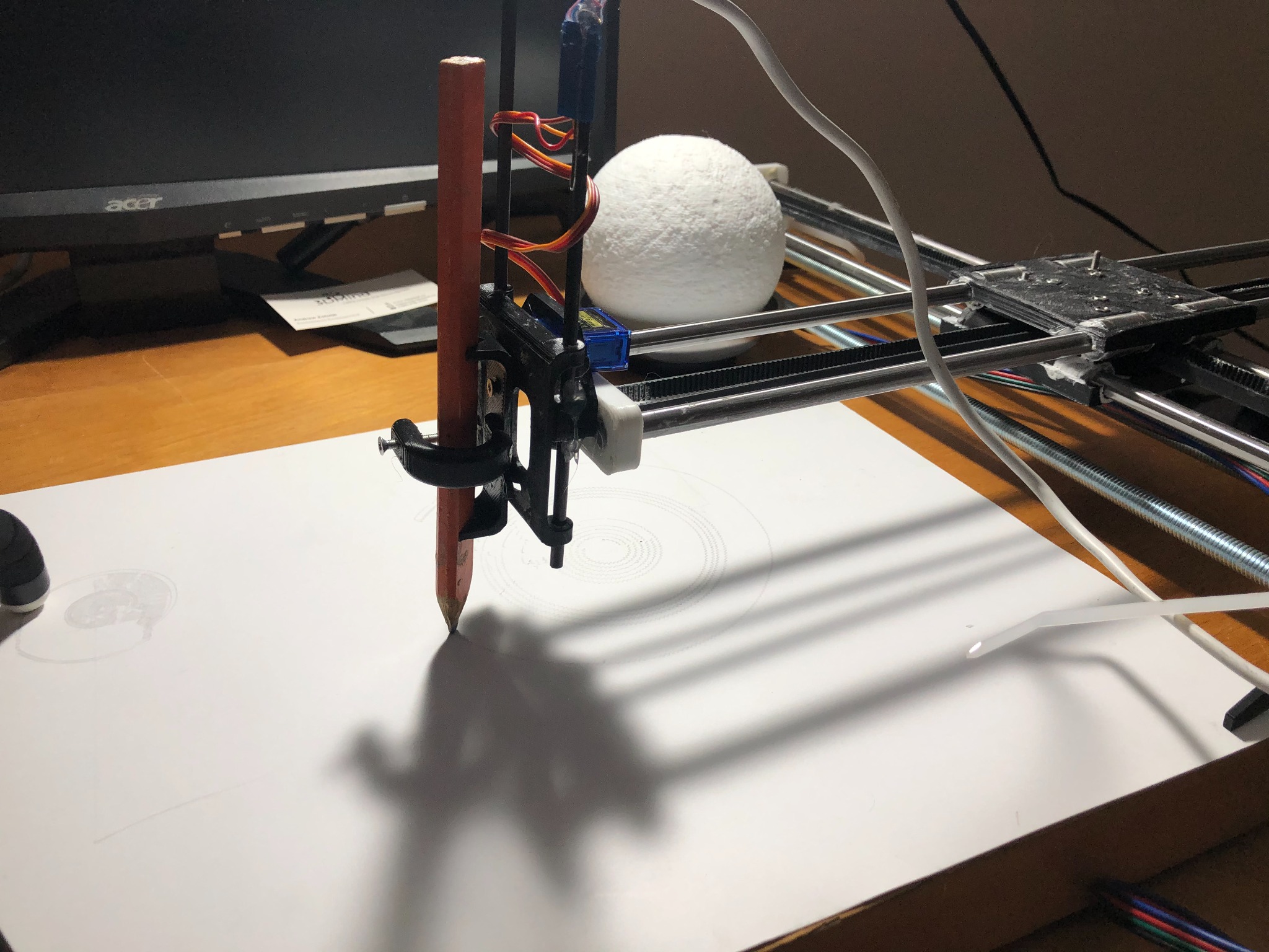Pen plotter drawing with a pencil held in its moving carriage