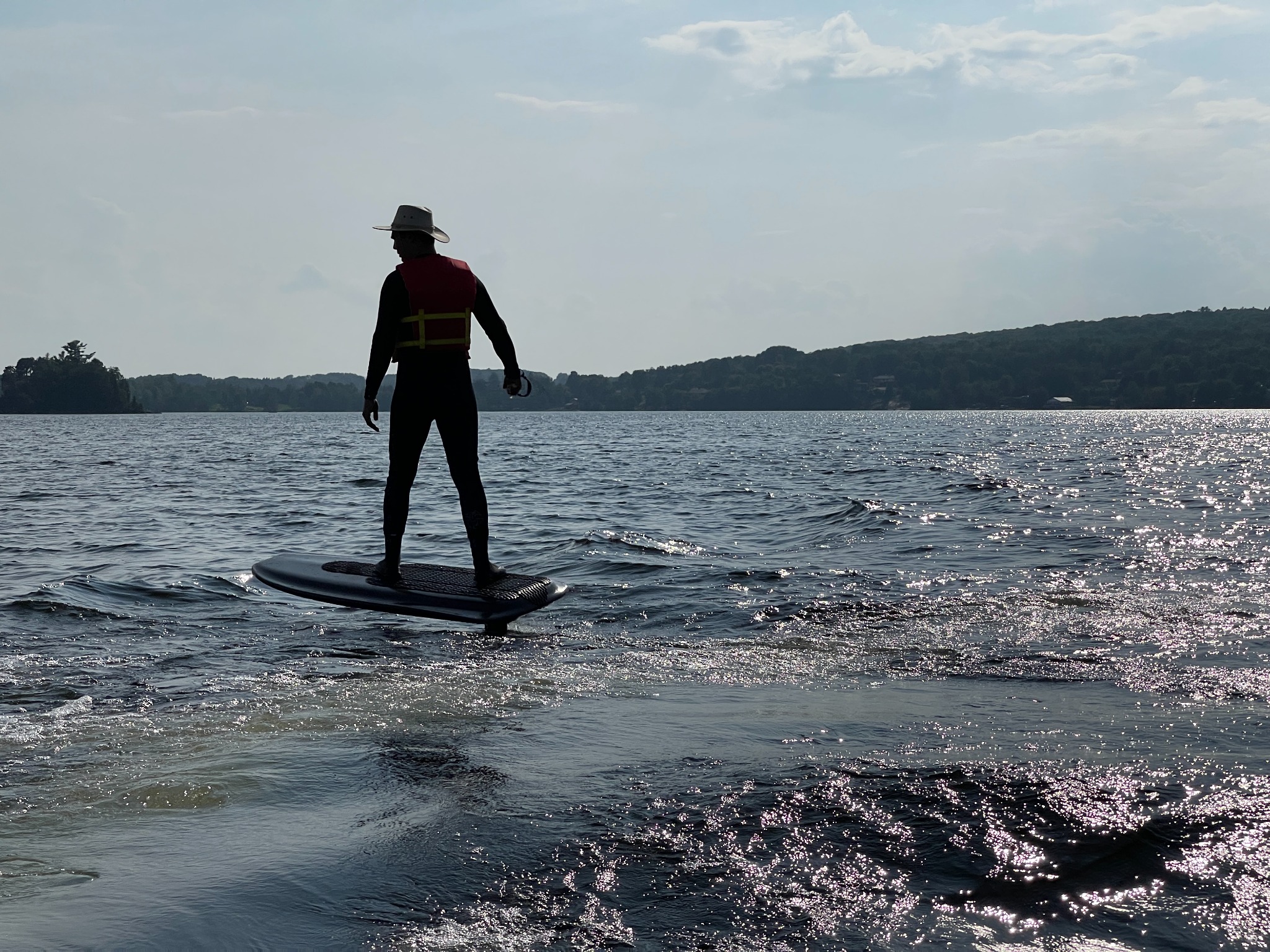 Andrii riding the electric hydrofoil board during on-water testing