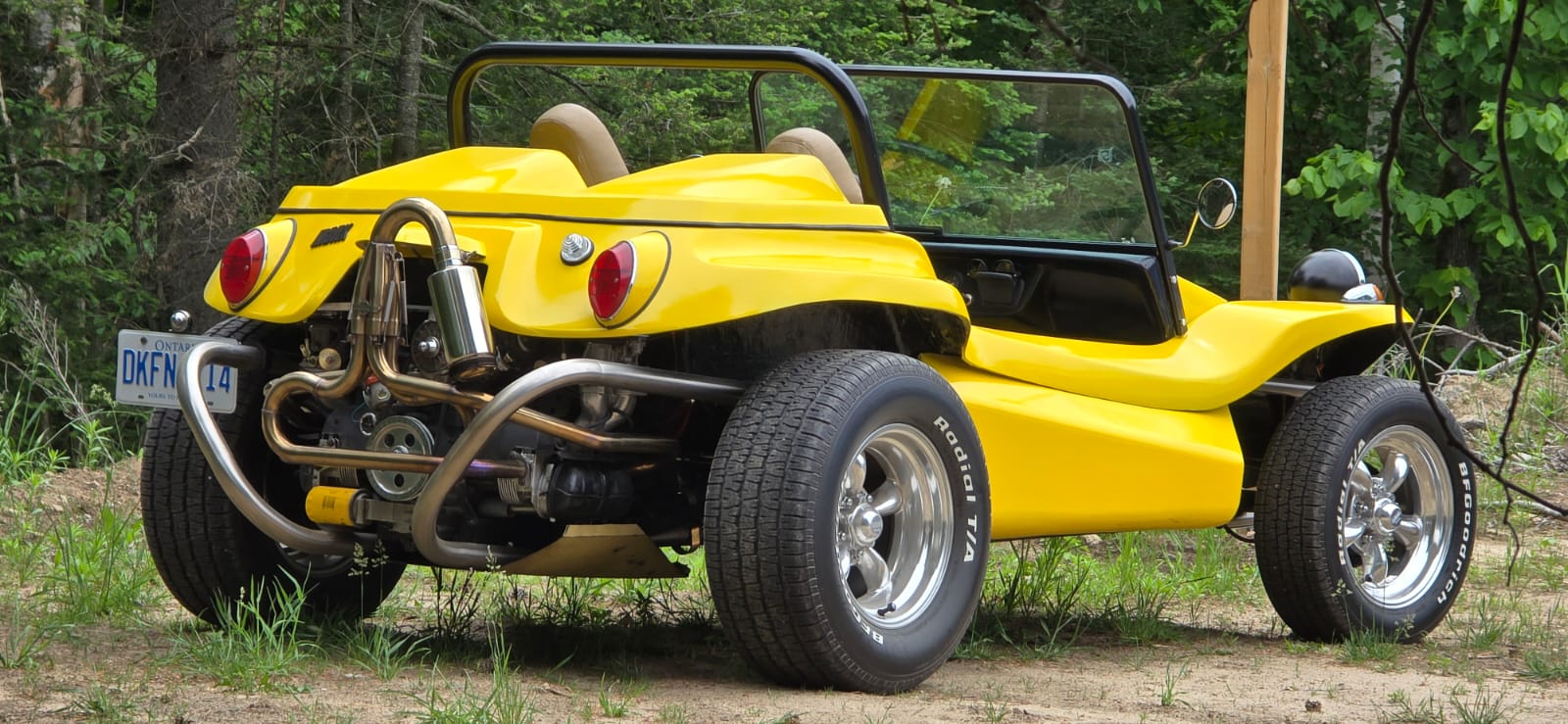 Rear three-quarter view of the completed yellow Manx dune buggy