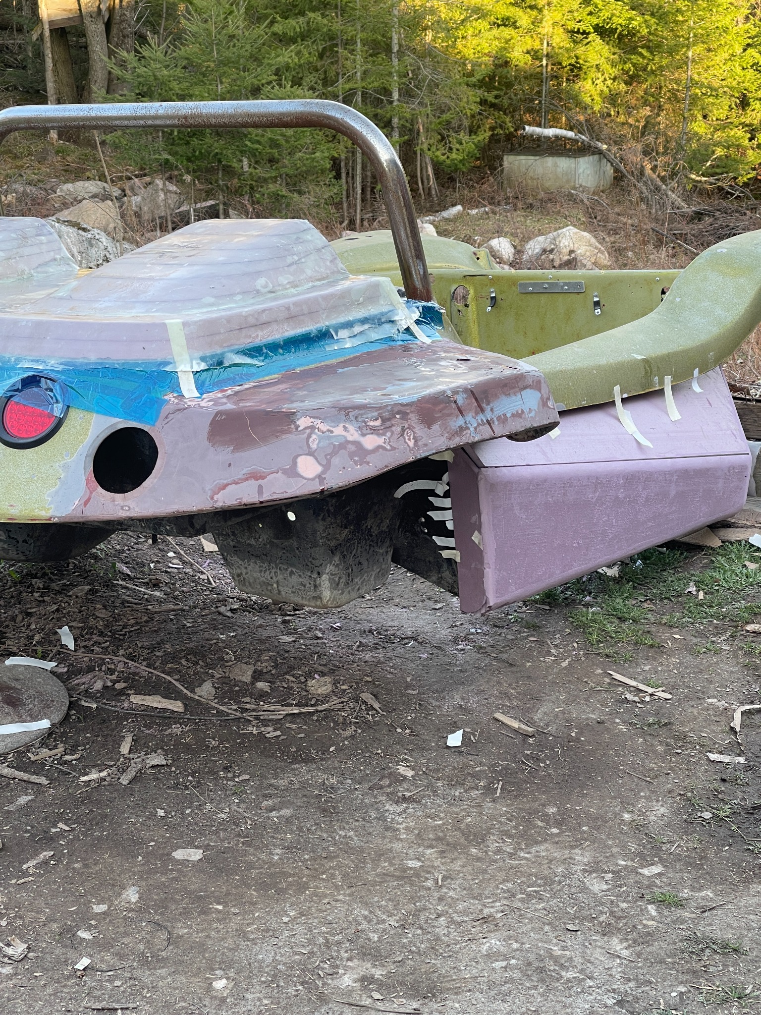 Fibreglass body repair and shaping work on the rear of the dune buggy