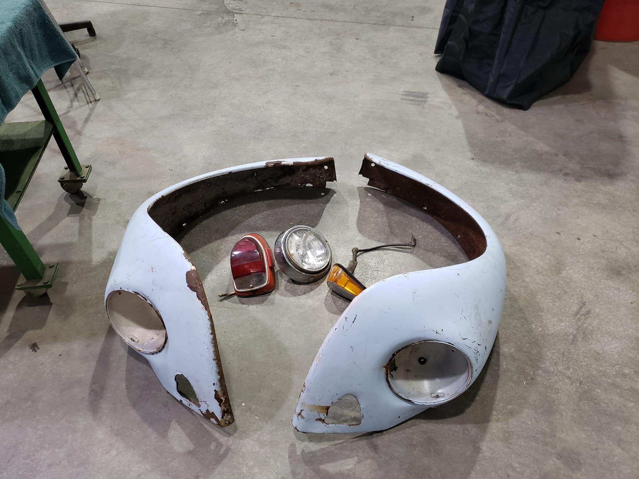Cut Volkswagen Beetle fender sections and lights before mini bike fabrication