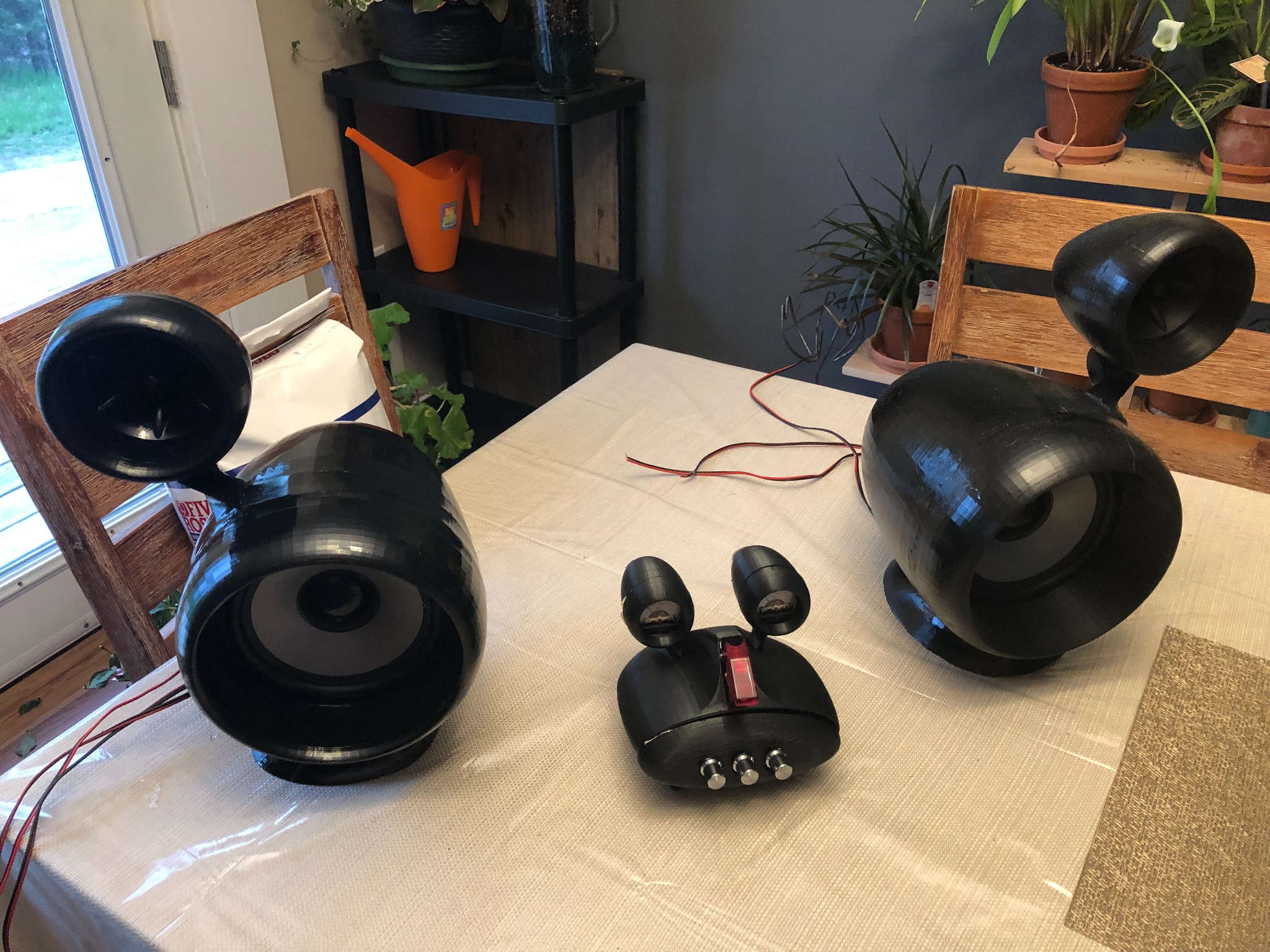 Set of black 3D-printed speaker enclosures