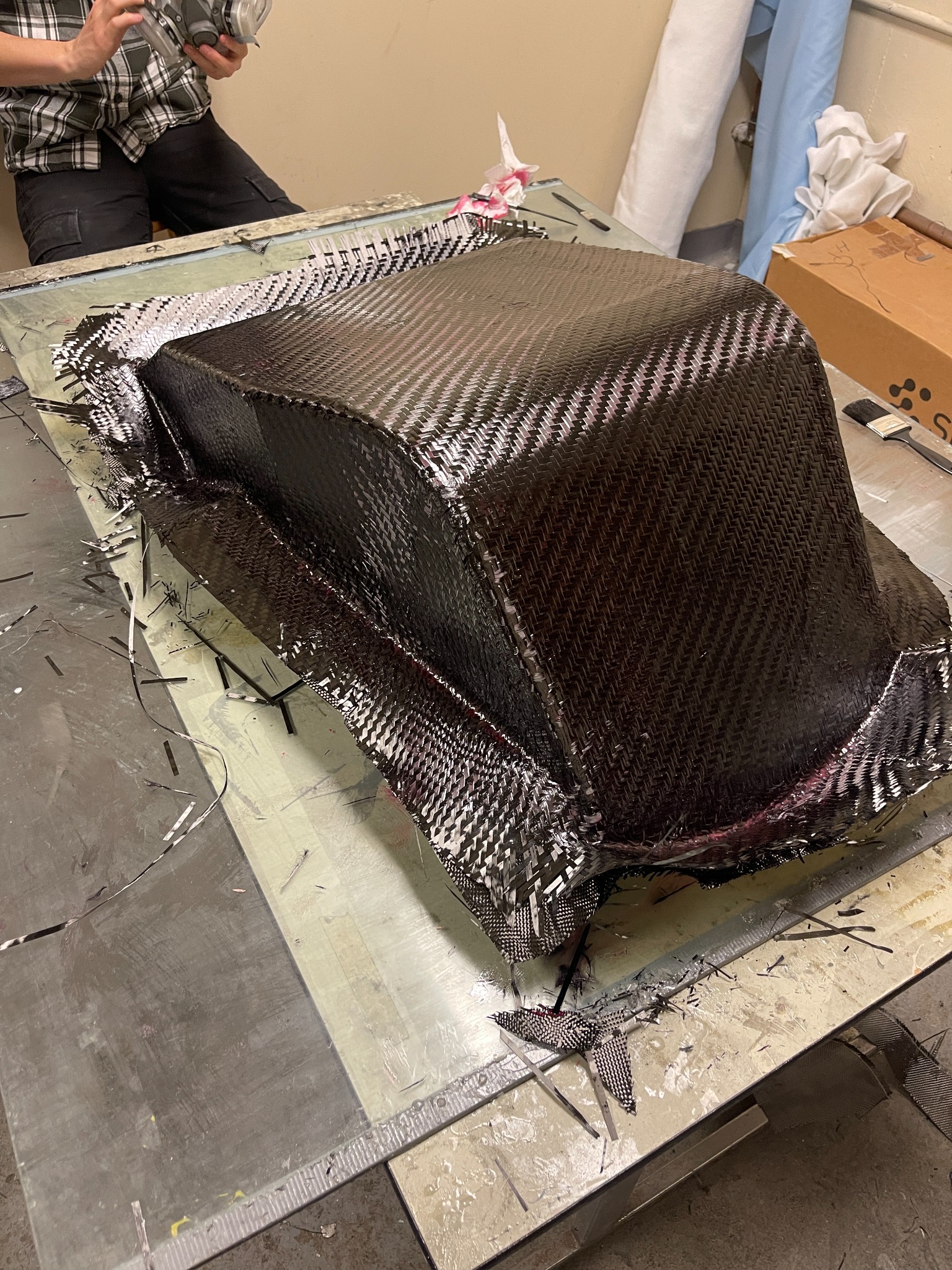 Carbon-fibre Formula-style seat during layup