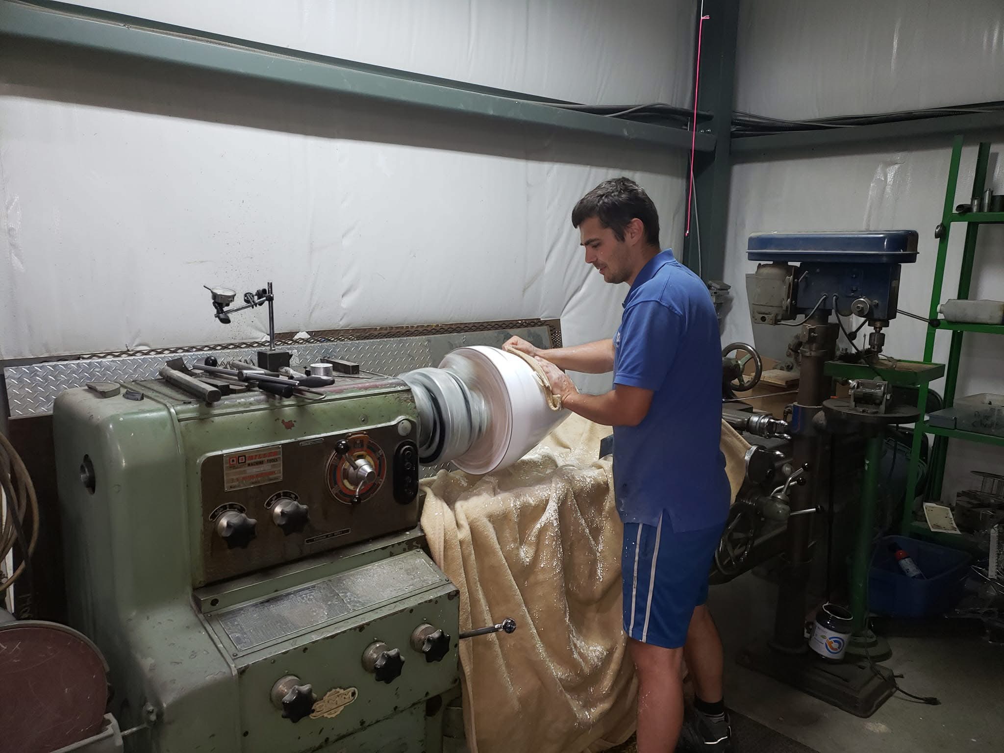 Andrii finishing an aircraft spinner tool on a lathe