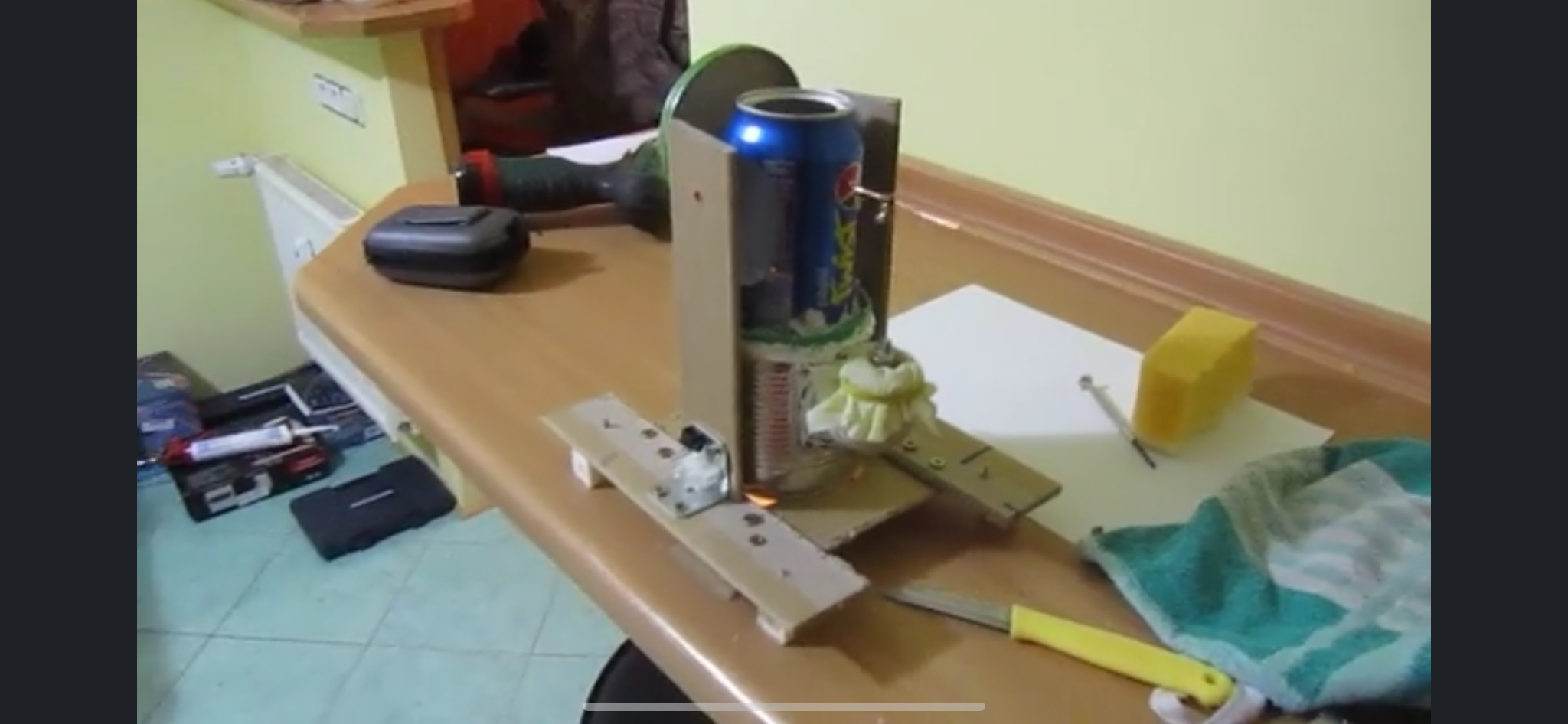 Homemade Stirling engine assembled from simple materials on a table