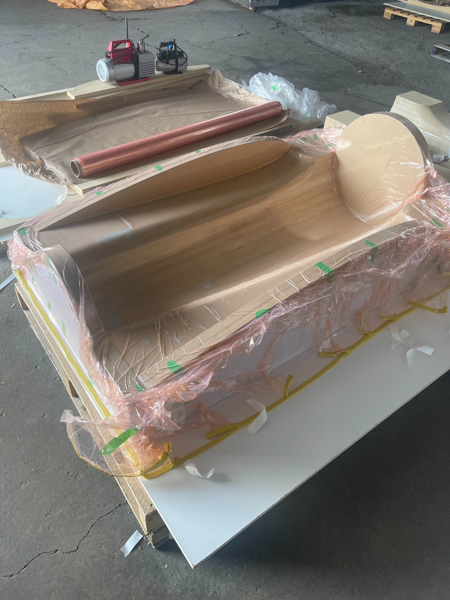 Composite material laid into a shaped UAV mold for vacuum bagging